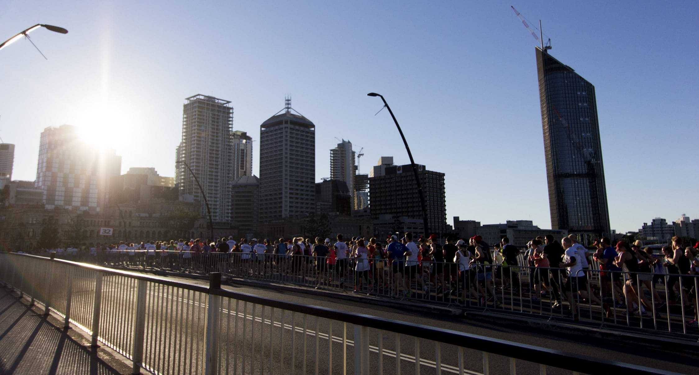 runners-crossing-go-between-bridge